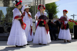 4 women in white dresses standing outside