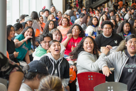 crowd of diverse high school students inside